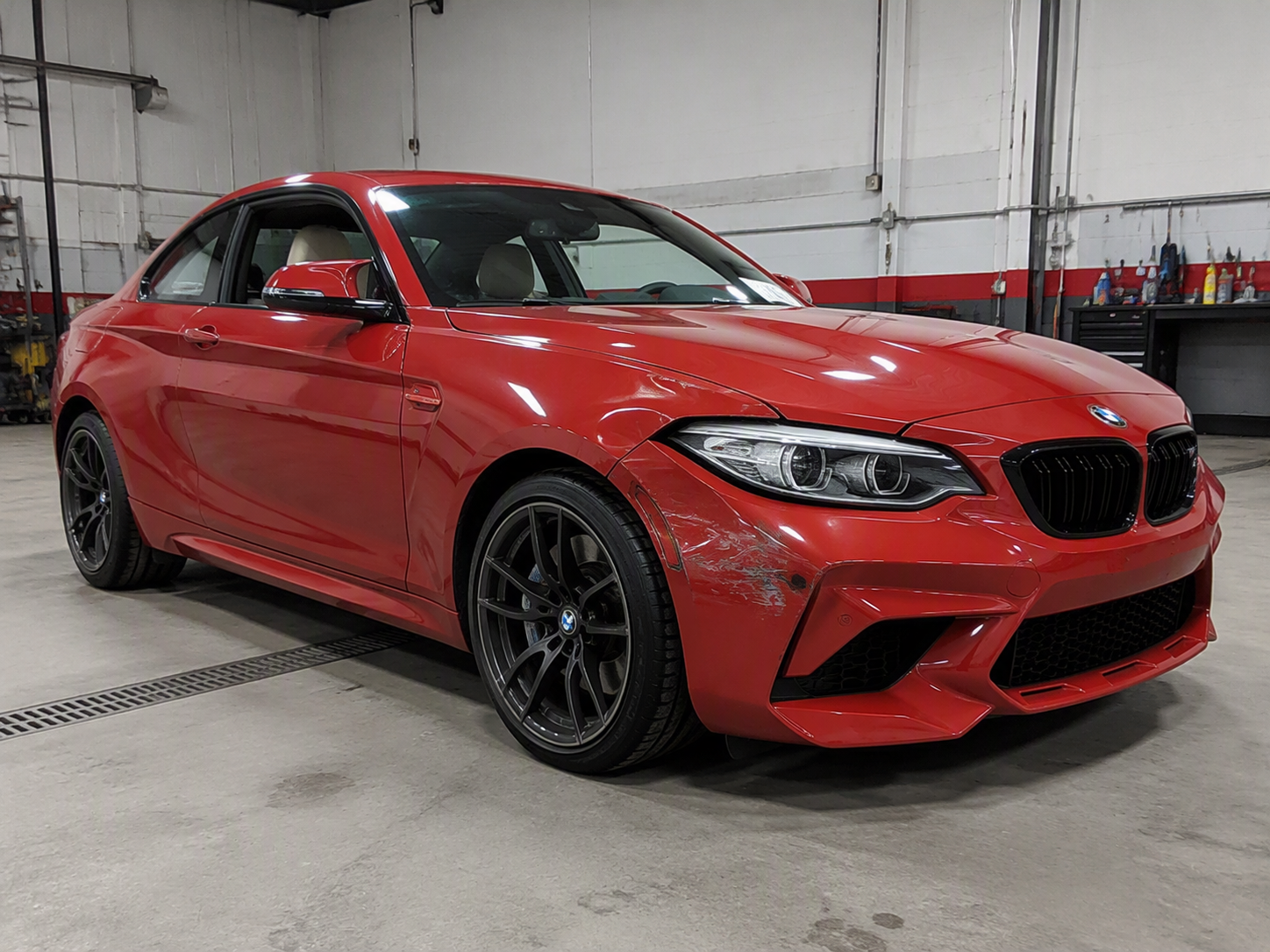 Before · BMW M2 front damage